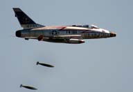 Picture of F-100D aircraft dropping napalm. Click on this picture to
start the video.