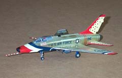 Picture of an F-100D in Thunderbird colors. Click on this picture to 
          start the video.