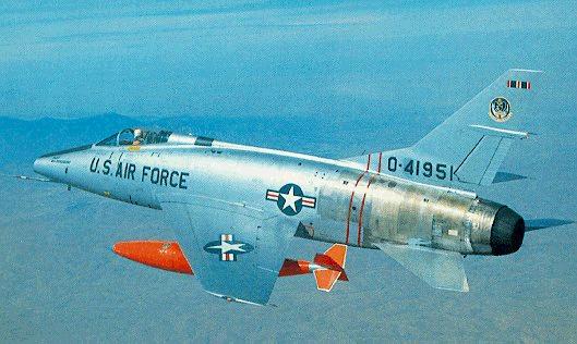 F-100D #54-1951, F-100C over mountain range (donated
 by Dick Roussell)