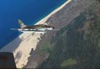 Picture of an F-100D over Vietnam. 
               Click on this picture to start the video.